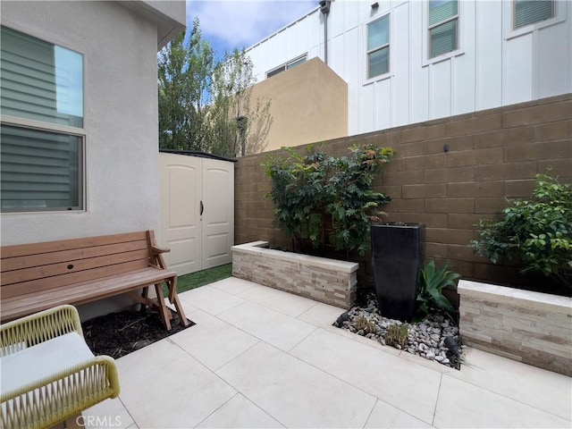 148 Spectacle, Irvine, CA 92618 - view of patio / terrace featuring a storage unit