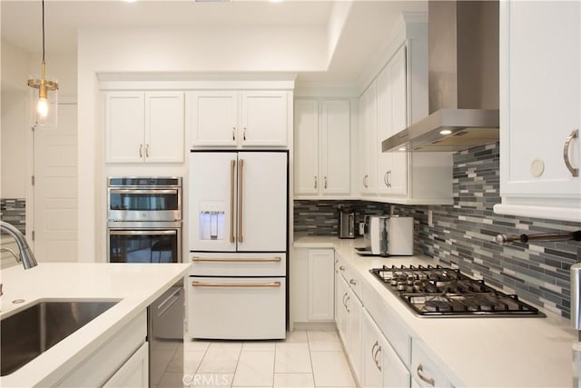 148 Spectacle, Irvine, CA 92618 - kitchen with appliances with stainless steel finishes, wall chimney range hood, light countertops, and decorative backsplash