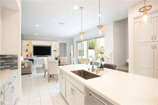 148 Spectacle, Irvine, CA 92618 - kitchen with light countertops, recessed lighting, decorative light fixtures, open floor plan, and white cabinets