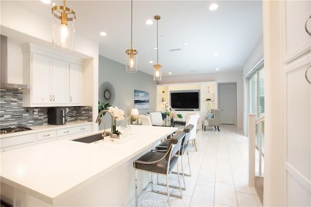 148 Spectacle, Irvine, CA 92618 - kitchen featuring backsplash, stainless steel gas cooktop, light countertops, white cabinets, and recessed lighting