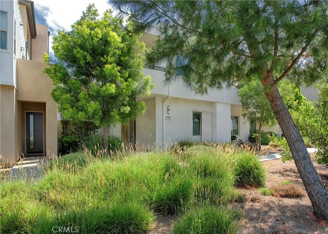 148 Spectacle, Irvine, CA 92618 - view of side of home featuring stucco siding