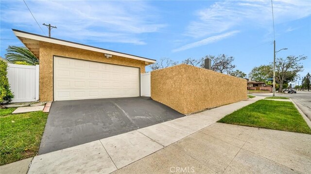 garage featuring fence