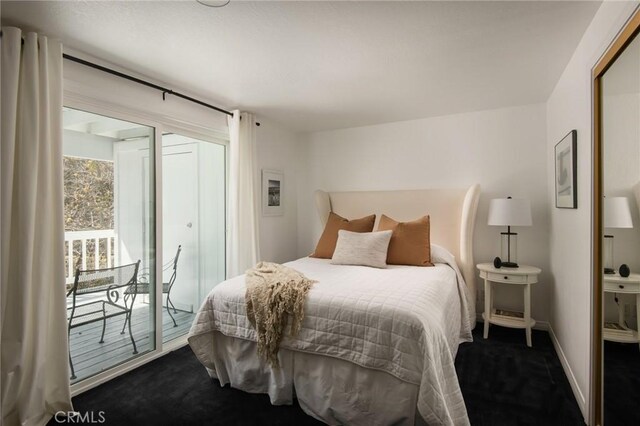 28956 Palisades Dr, Lake Arrowhead, CA 92352 - bedroom featuring dark carpet, access to outside, and baseboards