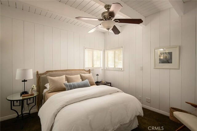 28956 Palisades Dr, Lake Arrowhead, CA 92352 - bedroom with beam ceiling, baseboards, a ceiling fan, and dark carpet