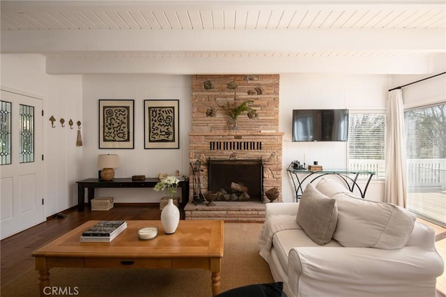 28956 Palisades Dr, Lake Arrowhead, CA 92352 - living room featuring wood finished floors, beamed ceiling, wooden ceiling, and a stone fireplace