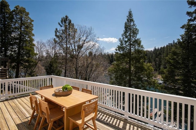 28956 Palisades Dr, Lake Arrowhead, CA 92352 - wooden terrace featuring outdoor dining space and a view of trees