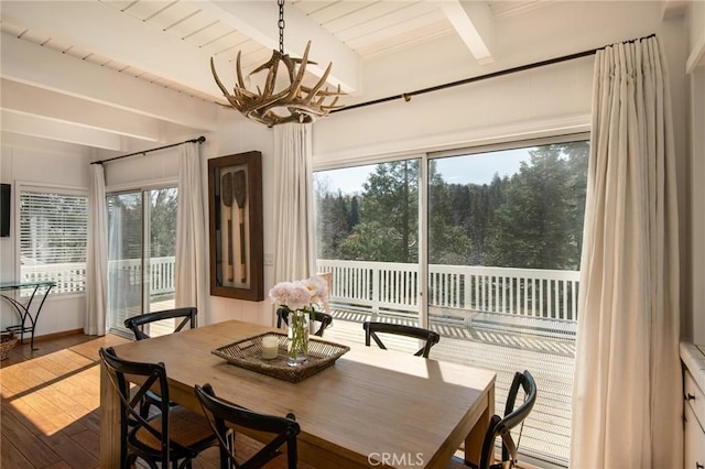 28956 Palisades Dr, Lake Arrowhead, CA 92352 - sunroom featuring beamed ceiling, a chandelier, and plenty of natural light