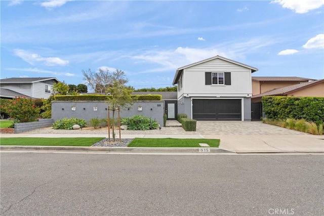 515 Traverse Dr, Costa Mesa, CA 92626 - traditional-style home featuring stucco siding, driveway, and an attached garage