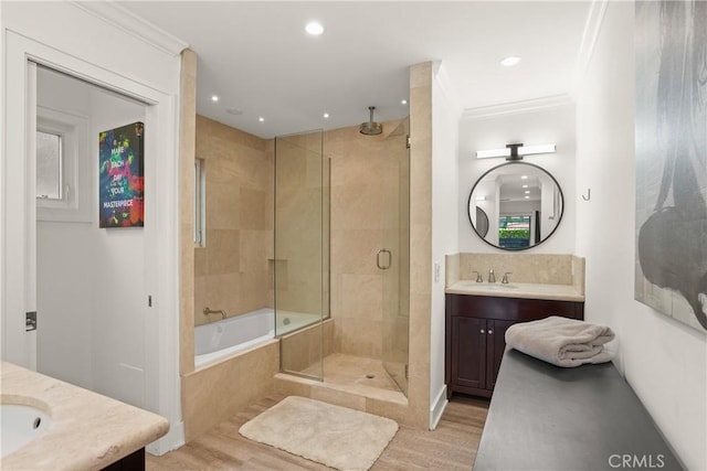 515 Traverse Dr, Costa Mesa, CA 92626 - bathroom featuring a shower stall, vanity, wood finished floors, recessed lighting, and a bath