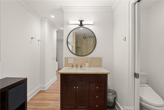 515 Traverse Dr, Costa Mesa, CA 92626 - bathroom with toilet, crown molding, baseboards, vanity, and wood finished floors