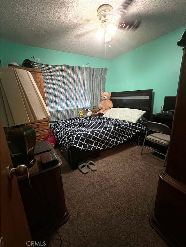 7477 Corona Ave, Hesperia, CA 92345 - bedroom featuring carpet floors, a textured ceiling, and a ceiling fan