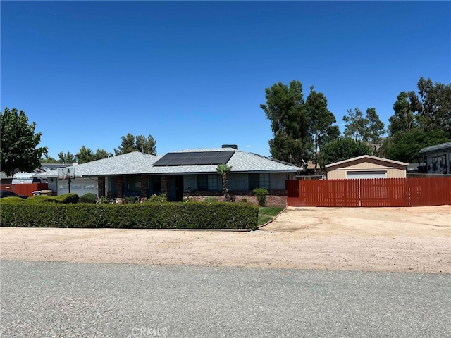 7477 Corona Ave, Hesperia, CA 92345 - single story home with solar panels and fence