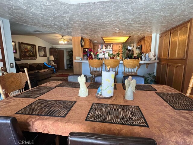 7477 Corona Ave, Hesperia, CA 92345 - dining area with lofted ceiling and a ceiling fan