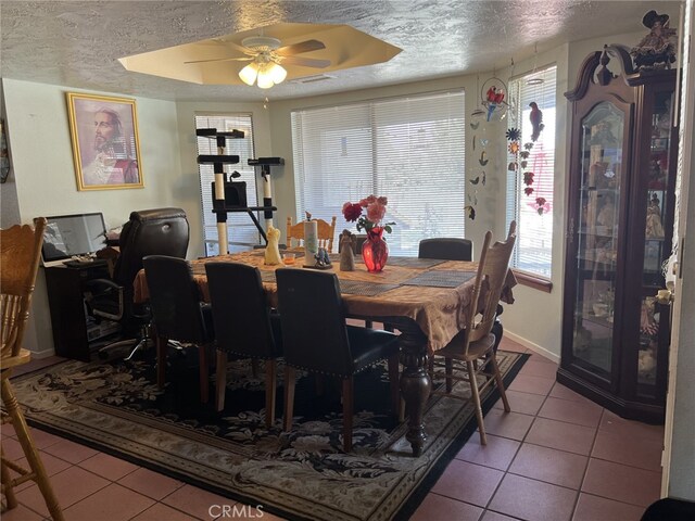 7477 Corona Ave, Hesperia, CA 92345 - dining area with tile patterned floors, ceiling fan, a textured ceiling, and baseboards
