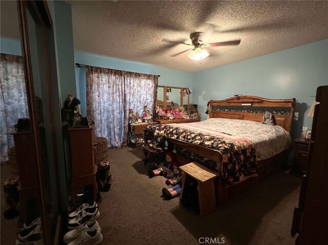 7477 Corona Ave, Hesperia, CA 92345 - carpeted bedroom featuring a textured ceiling and ceiling fan