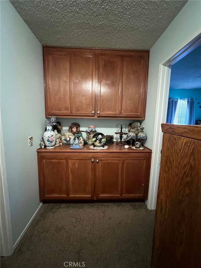 7477 Corona Ave, Hesperia, CA 92345 - bar area with dark colored carpet and a textured ceiling