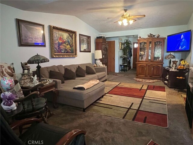 7477 Corona Ave, Hesperia, CA 92345 - living room featuring light colored carpet, vaulted ceiling, and ceiling fan