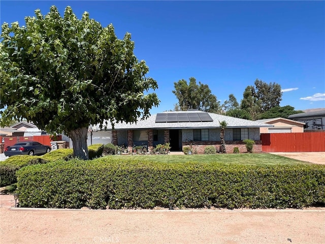 7477 Corona Ave, Hesperia, CA 92345 - view of front of house with roof mounted solar panels and stone siding