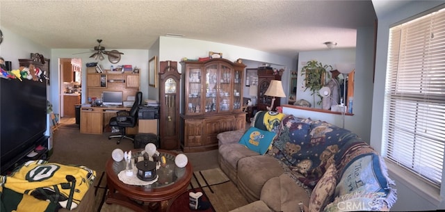 7477 Corona Ave, Hesperia, CA 92345 - carpeted living room with an office area, ceiling fan, and a textured ceiling