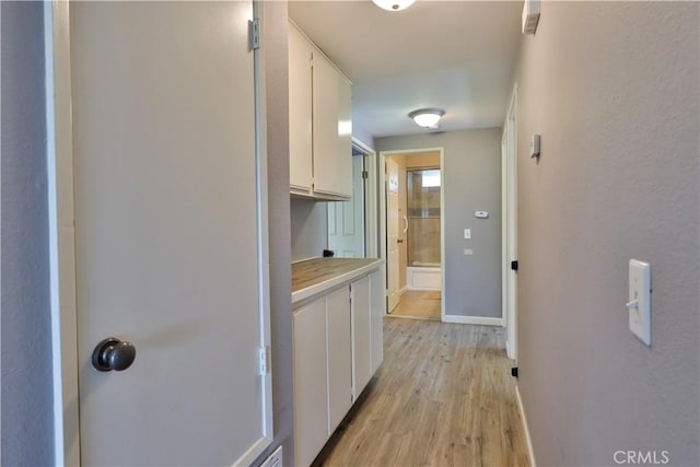 30681 Southern Cross Rd, Temecula, CA 92592 - hallway featuring light wood-style flooring and baseboards
