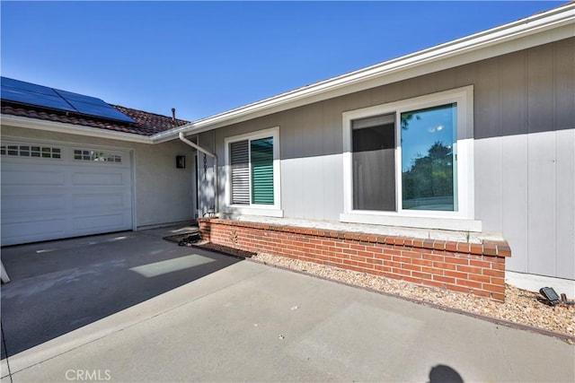 30681 Southern Cross Rd, Temecula, CA 92592 - property entrance with roof mounted solar panels, driveway, and a garage