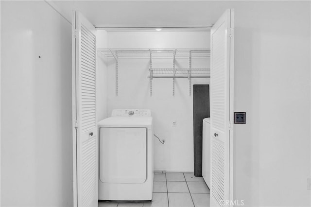 22800 Hilton Head Dr Unit 305, Diamond Bar, CA 91765 - laundry area featuring washer / dryer and light tile patterned flooring