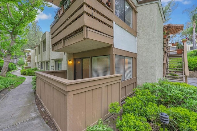 22800 Hilton Head Dr Unit 305, Diamond Bar, CA 91765 - view of side of home featuring stairs and stucco siding