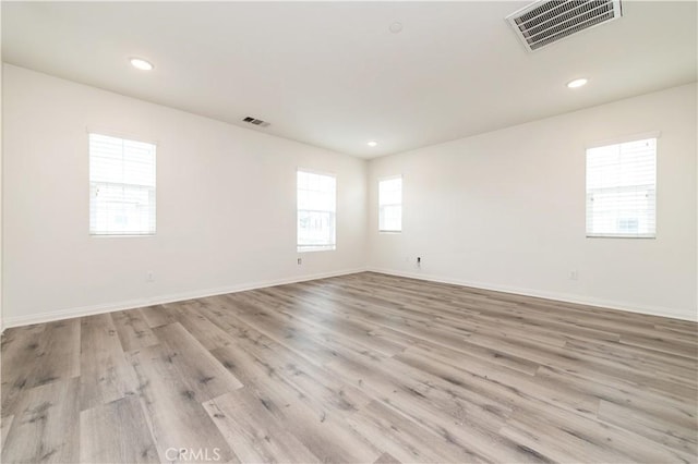 5961 Silveira St, Eastvale, CA 92880 - spare room featuring wood finished floors, baseboards, and recessed lighting