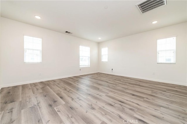 5961 Silveira St, Eastvale, CA 92880 - spare room with wood finished floors, baseboards, and recessed lighting