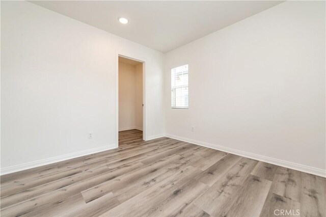 5961 Silveira St, Eastvale, CA 92880 - unfurnished room with baseboards, light wood-type flooring, and recessed lighting