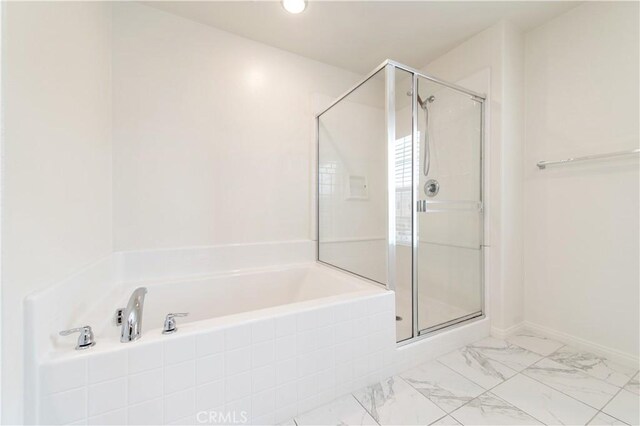 5961 Silveira St, Eastvale, CA 92880 - bathroom featuring a garden tub, a shower stall, and marble look tiles