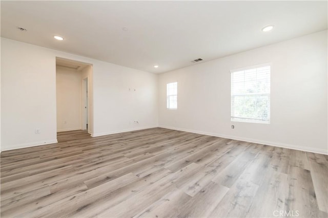 5961 Silveira St, Eastvale, CA 92880 - spare room with light wood-type flooring, baseboards, and recessed lighting