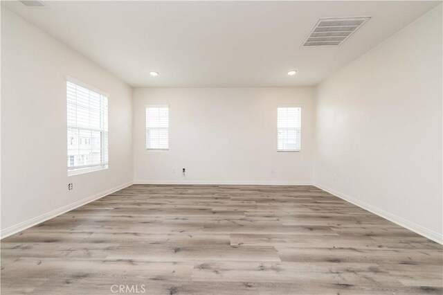 5961 Silveira St, Eastvale, CA 92880 - spare room with wood finished floors, baseboards, and recessed lighting