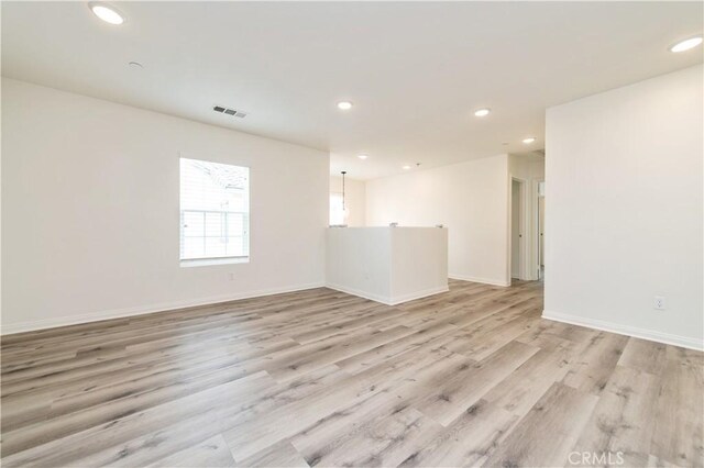 5961 Silveira St, Eastvale, CA 92880 - unfurnished room featuring recessed lighting, light wood-style flooring, and baseboards