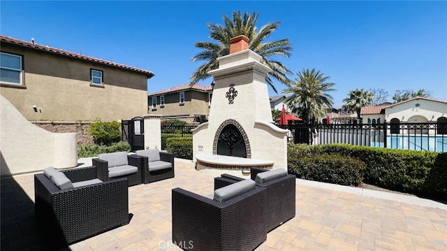 5961 Silveira St, Eastvale, CA 92880 - view of patio / terrace featuring an outdoor living space with a fireplace