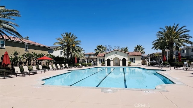 5961 Silveira St, Eastvale, CA 92880 - community pool with a patio and a residential view