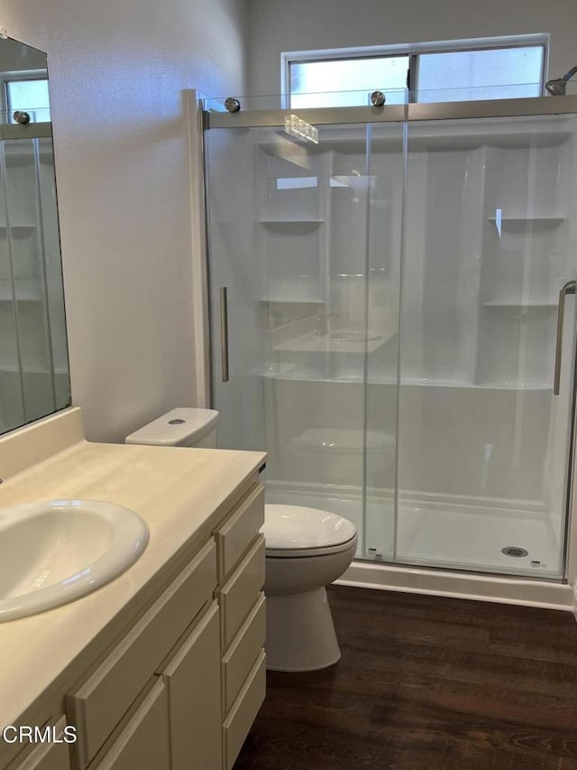 677 County Square Dr, Ventura, CA 93003 - bathroom with wood finished floors, toilet, a shower stall, and vanity