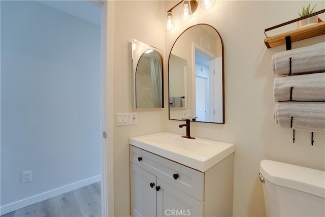 10319 Hemphill Ct, San Diego, CA 92126 - bathroom with vanity, wood finished floors, and toilet