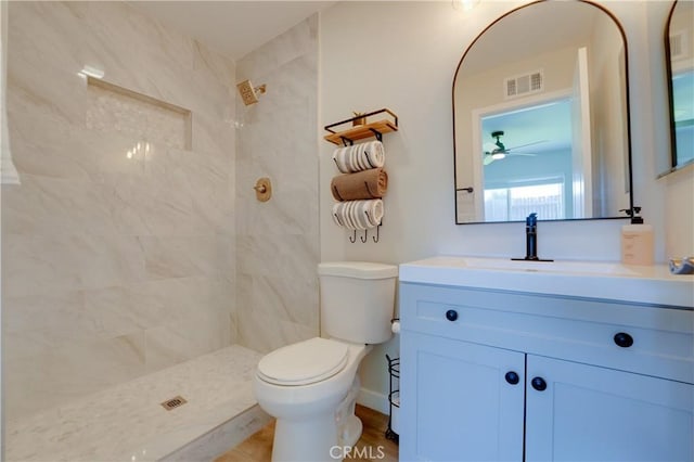 10319 Hemphill Ct, San Diego, CA 92126 - full bathroom with a tile shower, vanity, toilet, and a ceiling fan