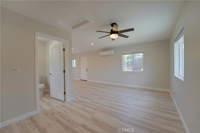 10319 Hemphill Ct, San Diego, CA 92126 - unfurnished room with a wall unit AC, light wood-type flooring, baseboards, and a ceiling fan