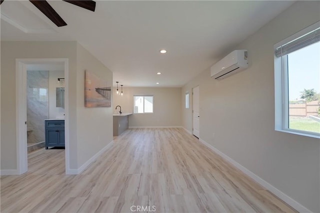 10319 Hemphill Ct, San Diego, CA 92126 - unfurnished living room featuring an AC wall unit, light wood finished floors, recessed lighting, ceiling fan, and baseboards