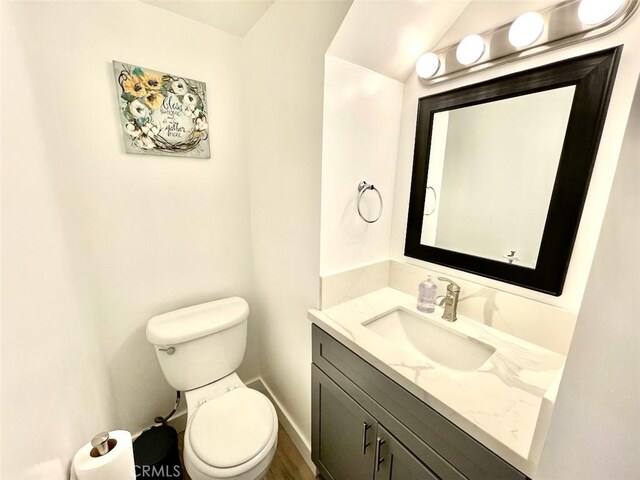 738 N Fairhaven St, Anaheim, CA 92801 - half bath featuring vanity, toilet, and baseboards
