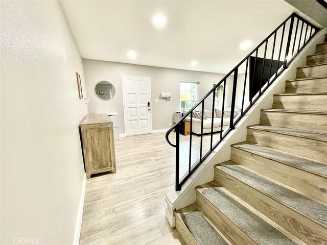 738 N Fairhaven St, Anaheim, CA 92801 - staircase featuring wood finished floors, recessed lighting, and baseboards