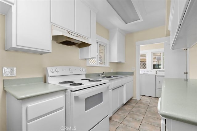 1810 Park St, Paso Robles, CA 93446 - kitchen featuring white electric range, washing machine and dryer, light countertops, and white cabinets