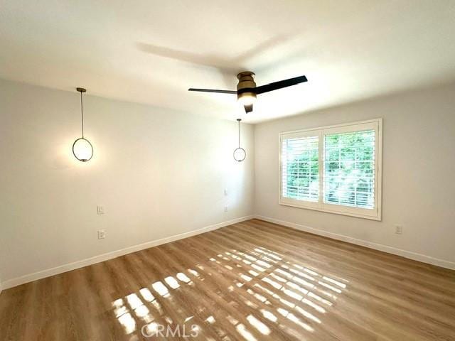 1428 Brett Pl Unit 86, San Pedro, CA 90732 - spare room with wood finished floors, baseboards, and ceiling fan