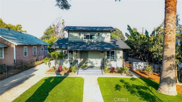bungalow-style home with covered porch, concrete driveway, and cooling unit