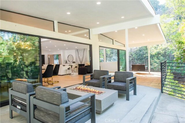 3920 Weslin Ave, Sherman Oaks, CA 91423 - view of patio / terrace with an outdoor living space with a fire pit