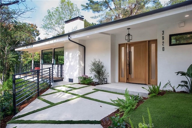 3920 Weslin Ave, Sherman Oaks, CA 91423 - doorway to property featuring stucco siding and a chimney
