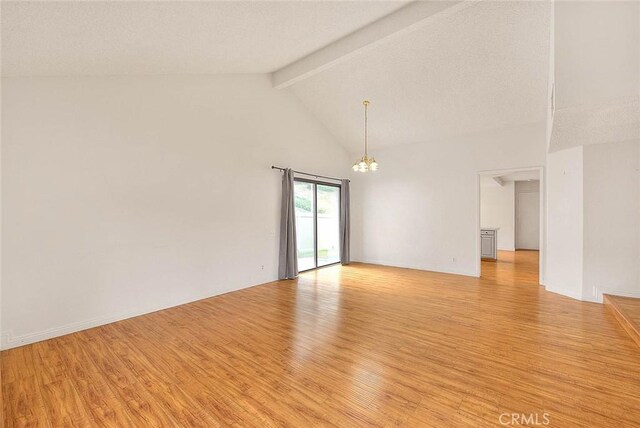 1207 Porto Grande Unit 1, Diamond Bar, CA 91765 - unfurnished room featuring a chandelier, light wood finished floors, beamed ceiling, and high vaulted ceiling