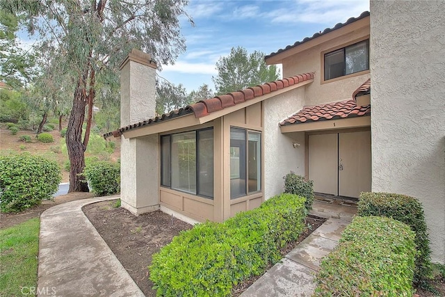 1207 Porto Grande Unit 1, Diamond Bar, CA 91765 - view of property exterior with a tile roof and stucco siding